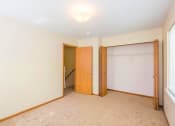 Thumbnail 3 of 23 - a bedroom with two doors and a window