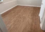 Thumbnail 4 of 6 - an empty room with hardwood floors