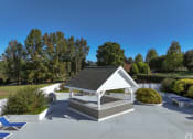 Thumbnail 23 of 23 - a white pavilion in a park with trees in the background