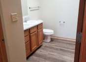 Thumbnail 13 of 14 - a bathroom with a toilet sink and mirror