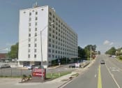 Thumbnail 2 of 11 - a large white building on the side of a road