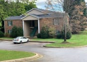 Thumbnail 21 of 23 - a house with a car parked in front of it