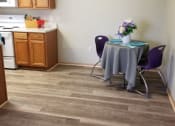 Thumbnail 11 of 14 - a kitchen with a table and chairs in it