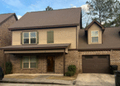 Thumbnail 1 of 18 - a house with a drive way in front of it