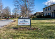 Thumbnail 13 of 23 - a sign in front of a house that says the apartments hickory east