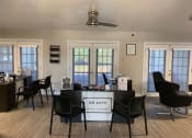 Thumbnail 7 of 23 - a room with a desk and chairs in it
