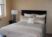 Thumbnail 8 of 11 - a bedroom with a bed and two nightstands