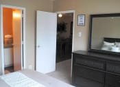 Thumbnail 9 of 11 - a bedroom with a bed and a mirror