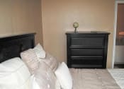 Thumbnail 11 of 11 - a bedroom with a bed and a dresser