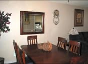 Thumbnail 7 of 11 - a dining room table with a mirror on the wall