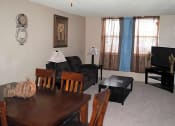 Thumbnail 3 of 11 - a living room filled with furniture and a flat screen tv