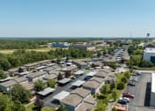 Thumbnail 19 of 23 - an aerial view of a neighborhood with many houses and trees