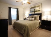 Thumbnail 10 of 15 - a bedroom with a bed and two night stands