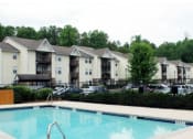 Thumbnail 1 of 6 - a swimming pool in front of a building