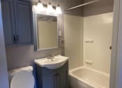 Thumbnail 11 of 13 - this is a photo of the bathroom in the 690 square foot 1 bedroom apartment at village