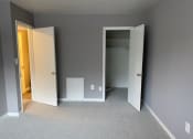 Thumbnail 10 of 13 - a bedroom with a closet and a door open
