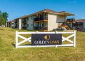 Thumbnail 5 of 23 - a sign in a grassy area with houses in the background