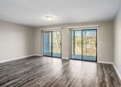 Thumbnail 3 of 23 - an empty living room with a sliding glass door