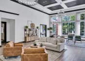 Thumbnail 5 of 25 - a living room with couches and chairs and a large window