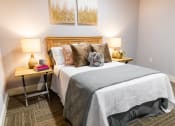 Thumbnail 25 of 106 - a bedroom with a bed and two night stands