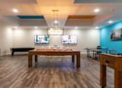 Thumbnail 63 of 106 - a billiards room with a pool table and televisions
