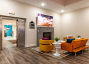 Thumbnail 59 of 106 - a living room with a fireplace and a tv
