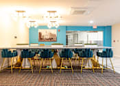 Thumbnail 51 of 106 - a long table with chairs in a room with a blue wall