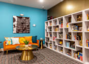 Thumbnail 54 of 106 - the lobby of a library with a couch and tables