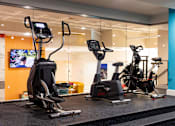 Thumbnail 70 of 106 - a gym with exercise equipment in the lobby of a building