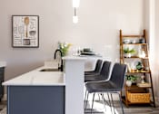 Thumbnail 4 of 38 - A kitchen with a white counter and a sink.