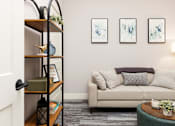 Thumbnail 10 of 38 - A living room with a couch, a coffee table, and a bookshelf.