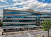 Thumbnail 33 of 33 - an office building with a glass facade with the words bulding guardian on it