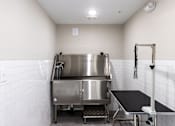 Thumbnail 37 of 50 - A stainless steel kitchen with a large pot on the stove.
