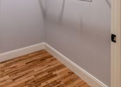 Thumbnail 14 of 50 - A white wall with a white door and a white electrical outlet.