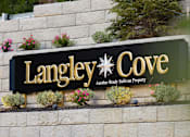 Thumbnail 20 of 24 - A sign that says Langley Cove in gold lettering.