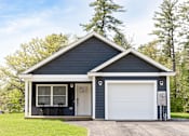 Thumbnail 26 of 60 - A two-car garage with a white door and a small porch.