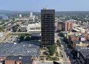 Thumbnail 1 of 106 - an aerial view of a city with a river in the background