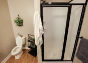 Thumbnail 8 of 8 - a bathroom with a toilet and a glass shower