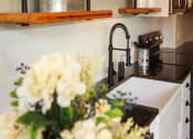 Thumbnail 4 of 8 - a kitchen with a sink and a counter top