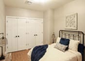 Thumbnail 2 of 8 - a bedroom with a bed and a closet