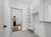 Thumbnail 10 of 103 - a white closet with shelves and a toilet in it