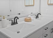 Thumbnail 14 of 99 - a white bathroom with two sinks and a mirror