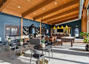 Thumbnail 33 of 99 - A modern cafe with wooden tables and chairs.