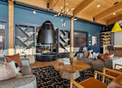 Thumbnail 47 of 99 - A modern living room with a fireplace and a large rug.