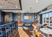 Thumbnail 54 of 99 - A modern bar area with a pool table and comfortable seating.