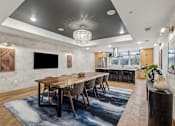 Thumbnail 40 of 103 - A modern dining room with a wooden table and chairs.