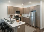 Thumbnail 9 of 33 - Well Equipped Eat-In Kitchen at Foothill Lofts Apartments & Townhomes, Logan, UT, 84341