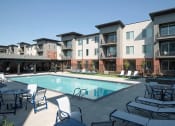 Thumbnail 23 of 33 - Swimming Pool And Sundeck at Foothill Lofts Apartments & Townhomes, Logan, 84341