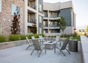 Thumbnail 66 of 75 - Parc on 5th Apartments & Townhomes fire pit and seating area.