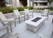 Thumbnail 64 of 75 - Fire pit and chair at Parc on 5th Apartments & Townhomes